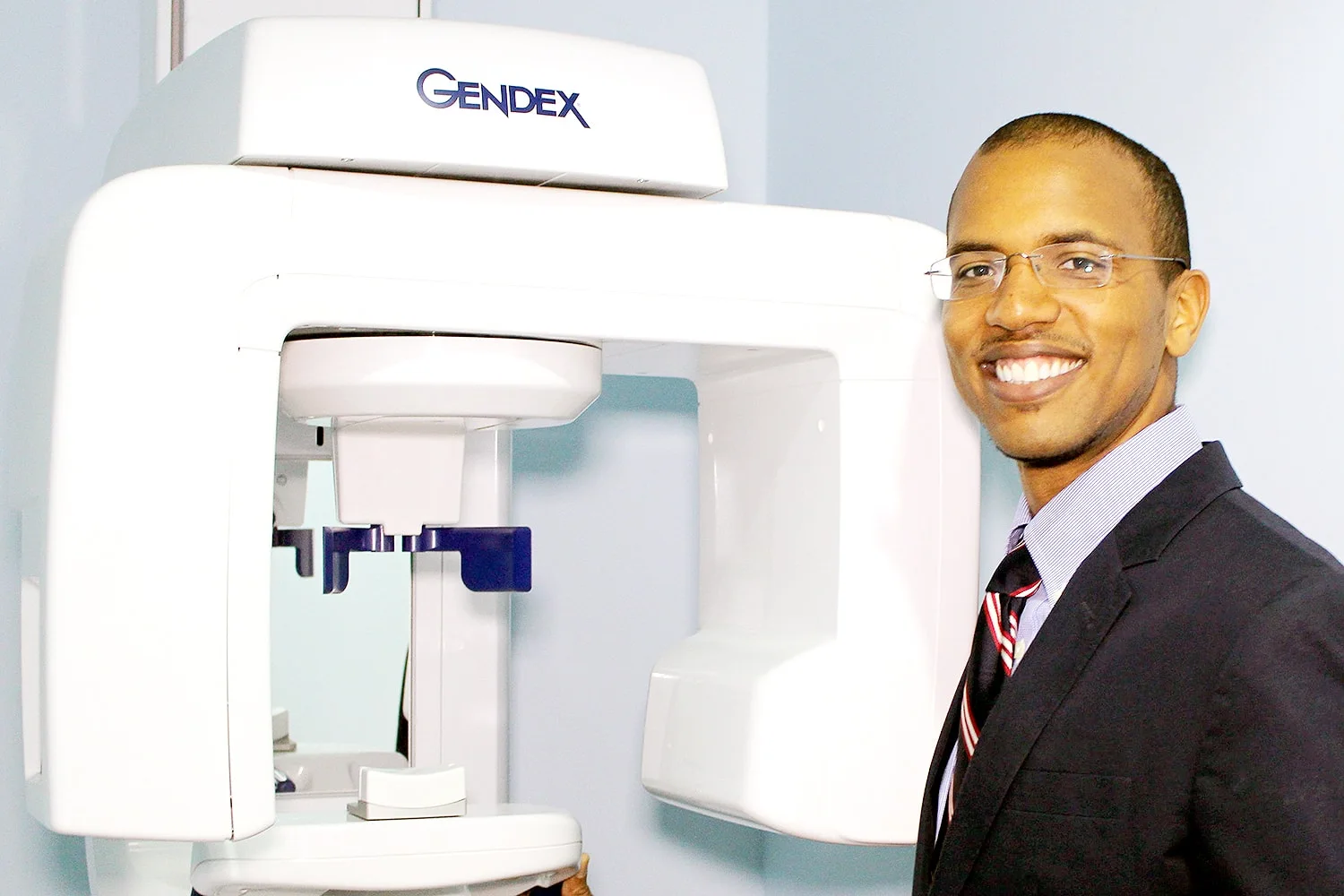 Dr. Benjamin Shirley beside the practice's digital X-ray unit